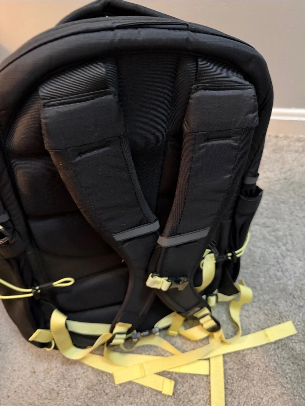The North Face Black Backpack with Yellow Bungee and Straps